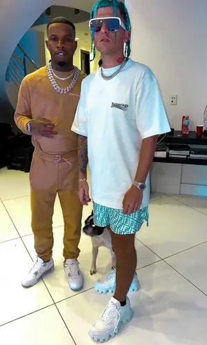 Rarri wearing Prada sneakers