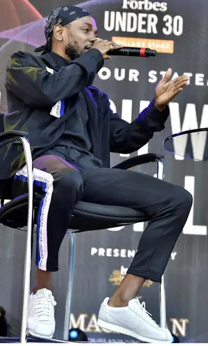 Kendrick Lamar wearing Brothers 4 Life pants