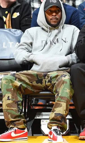 Kendrick Lamar wearing Kendrick Lamar Merch cap
