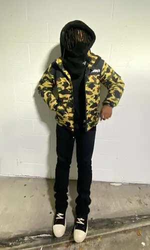 sgpwes wearing Bape jacket
