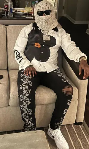 Babyface Ray wearing Amiri jeans