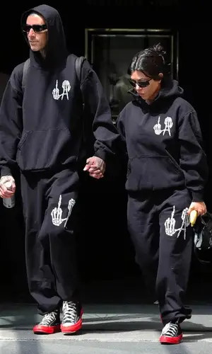 Kourtney Kardashian’s Outfit in Comme Des Garcons Sneakers, Balenciaga Bag & Converse (2022)