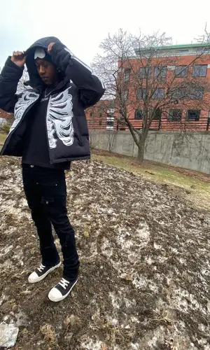 Lil Benny wearing PrayForOurYouth hat