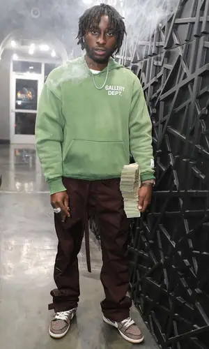 Lil Dann wearing Nike sneakers