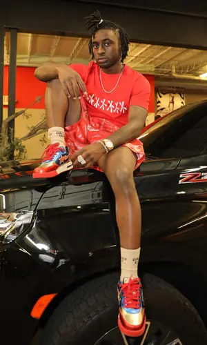 Lil Dann wearing Bape sneakers