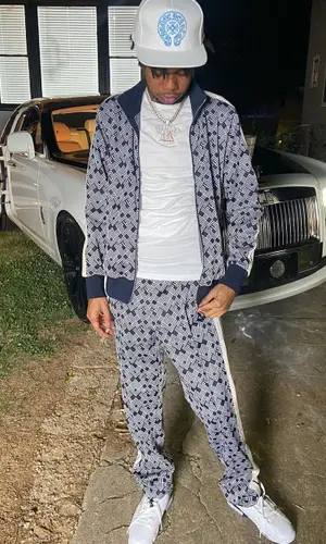 Lil Poppa wearing Chrome Hearts cap