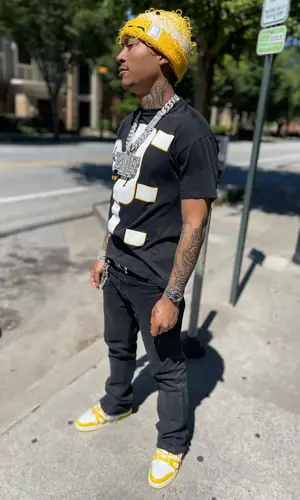 Lil Meech wearing Chrome Hearts belt