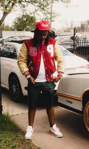 Babyface Ray wearing Gucci shorts