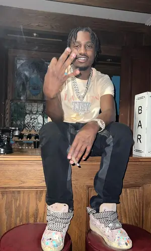 Lil Tjay wearing Gallery Dept. pants