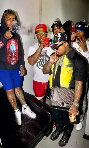Doe Boy wearing Palm Angels cap