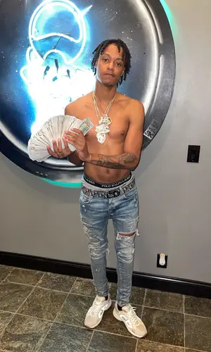 Skilla Baby wearing Dior belt