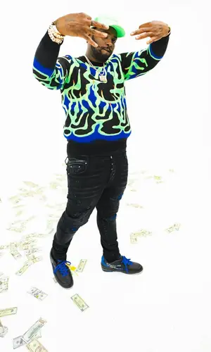 Peezy wearing Louis Vuitton sweater