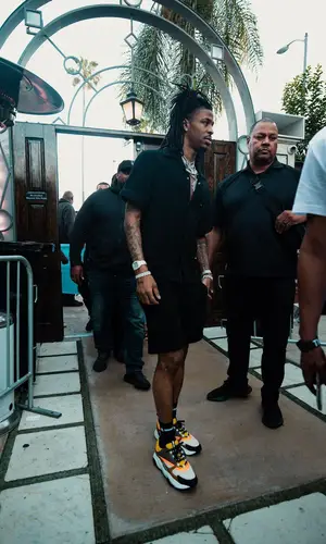Ja Morant wearing Prada shirt