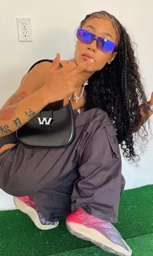 Coi Leray wearing Balenciaga eyewear