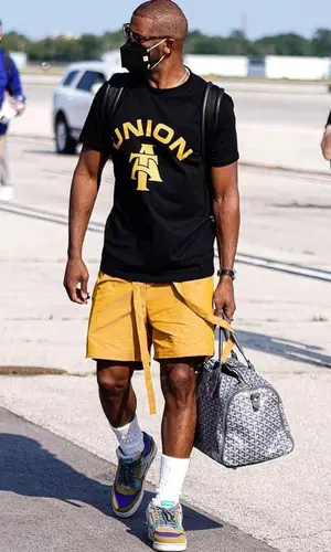 Chris Paul’s Outfit in Jordan Sneakers, Goyard Bag & Henry Mask (2021)