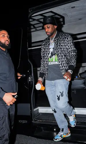 Fabolous wearing Global Currency hat