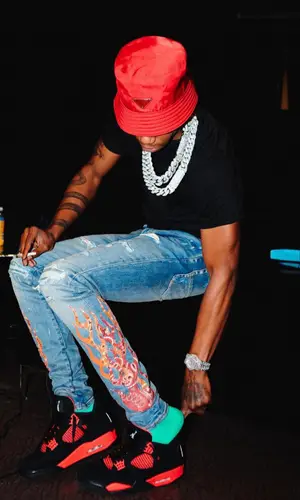 A Boogie Wit Da Hoodie wearing Prada hat