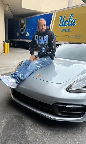 Amari Bailey’s Outfit in Juice Wrld Merch Hoodie, Olivier Rogers Jeans & Nike Sneakers (2022)