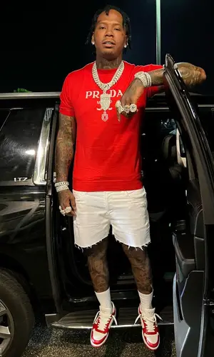 Moneybagg Yo wearing Prada sweater