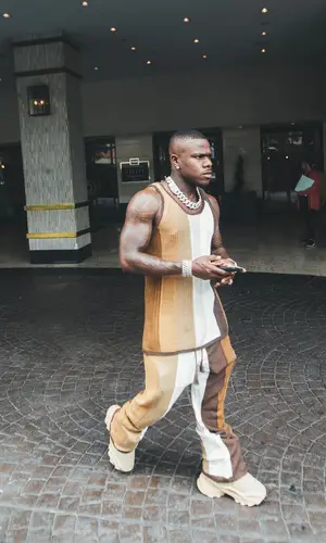 DaBaby wearing Amiri top