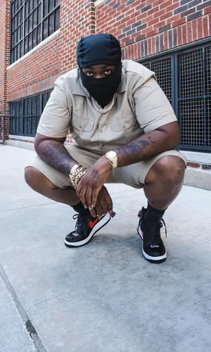 Peezy wearing Dickies shirt