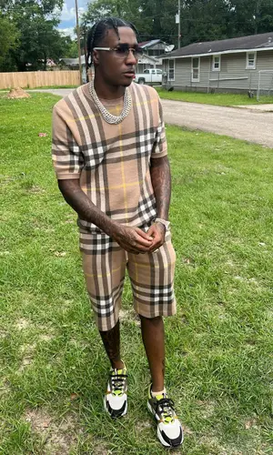 MGM Lett wearing Burberry t-shirt