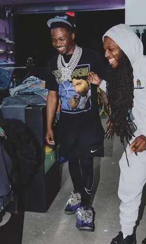 Roddy Ricch wearing Nike shorts