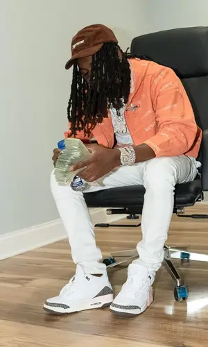 SleazyWorld Go wearing Supreme cap