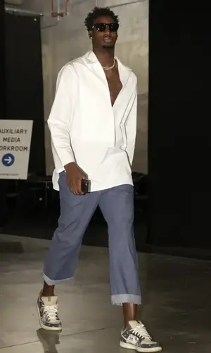 Jaren Jackson Jr.’s Outfit in Jil Sander Shirt, Maison Margiela Jeans & Travis Scott Merch Sneakers (2022)