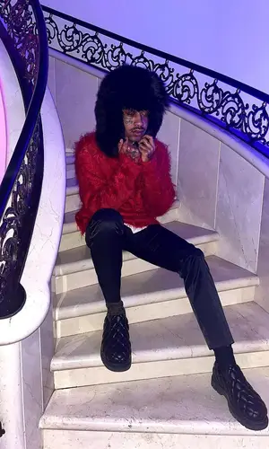 Lil Tracy wearing Bottega Veneta boots