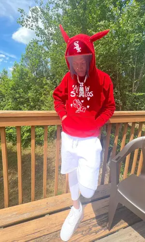 2KBABY wearing New Era cap