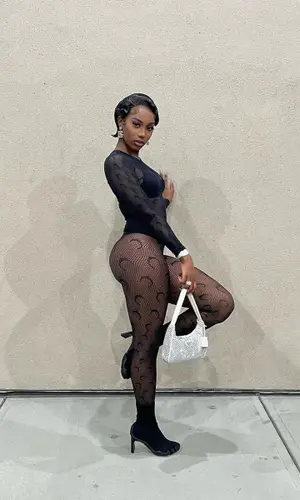 Flo Milli wearing Prada bag