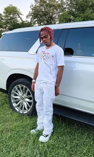 CKay wearing Who Decides War pants