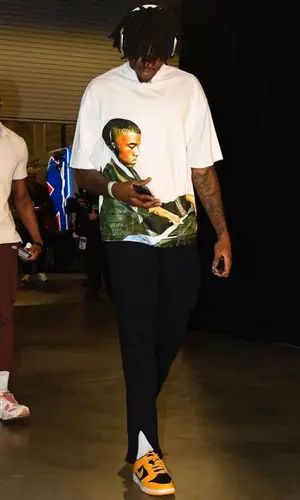 Robert Williams wearing Do Not Disturb. pants