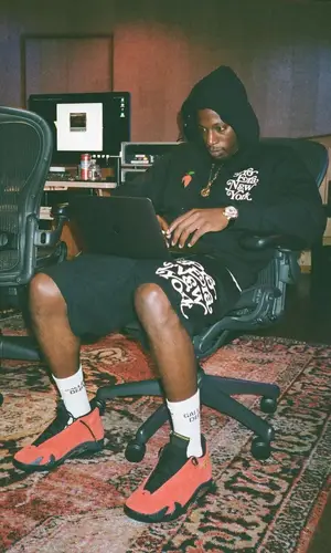 Joey Badass’ Outfit in Pro Era Hoodie, Jordan Sneakers & Gallery Dept. Socks (2022)