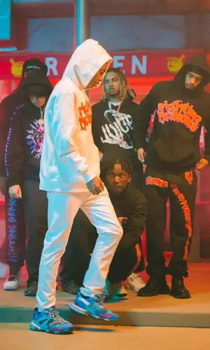 Amari Bailey’s Outfit in Vlone Hoodie, Prada Sneakers & Juice Wrld Merch (2022)