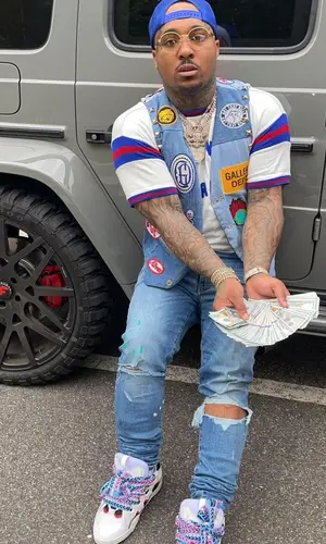 Doe Boy wearing Saint Laurent t-shirt