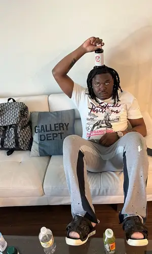 Lucki wearing Gallery Dept. pants