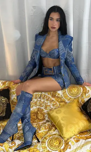 Dua Lipa wearing Versace boots