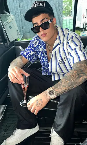Lunay’s Outfit in Prada Shirt, Louis Vuitton Eyewear & Chrome Hearts Cap (2022)