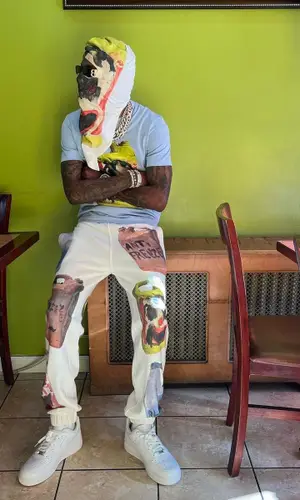 Rich The Kid wearing Givenchy pants