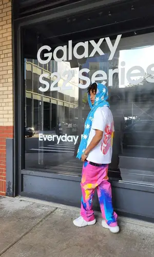 Jaden Smith wearing Jaden Smith Merch sneakers