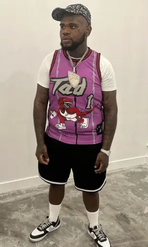 Fat Boy wearing Supreme cap