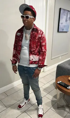Lil Gotit wearing Von Cre jacket