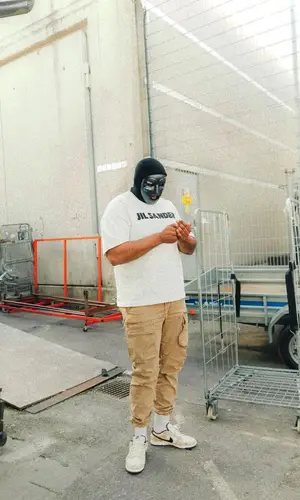 M Huncho wearing Nike sneakers
