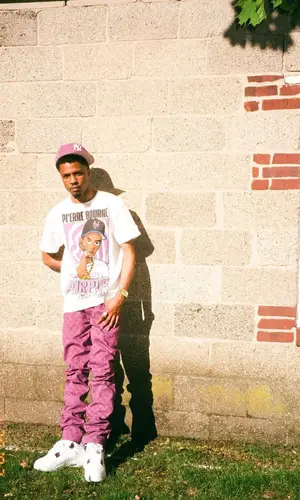Pierre Bourne’s Outfit in Louis Vuitton Pants, Jordan Sneakers & Jae Tips Cap (2022)
