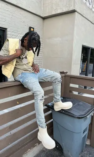 Polo G wearing Bottega Veneta boots