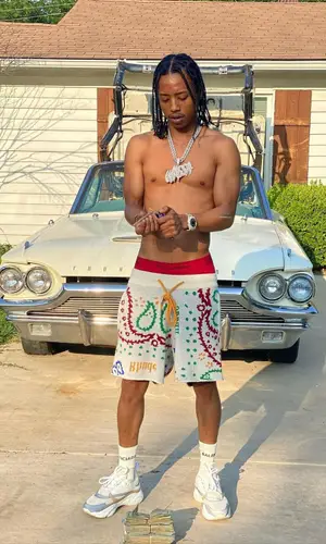 Pressa wearing Rhude shorts