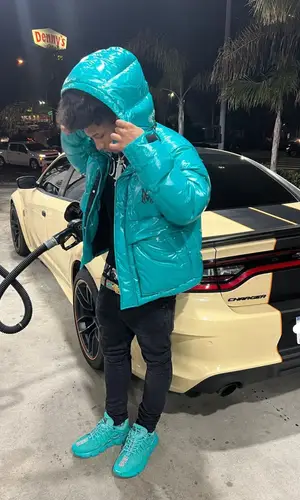 Mikey wearing Valabasas jeans