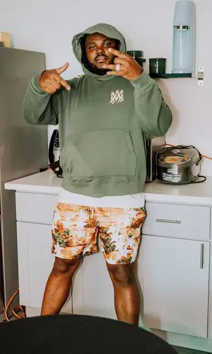 Tee Grizzley wearing Amiri shorts